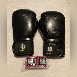 New set of black boxing gloves with hand wraps